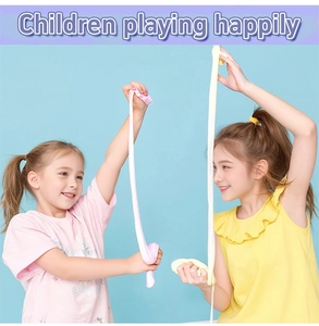 Kids stretching stretchy pink and yellow butter slime kit against a blue background