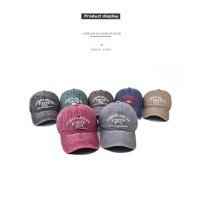 Group display of washed cotton baseball caps in seven vintage colors with YOUTH embroidery