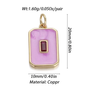 Detail showing red stone pendant with purple enamel inlay and dimensions 20mm x 10mm