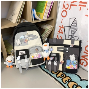 Detailed set of cute school backpack and matching tote bag with plush charms and clear pockets