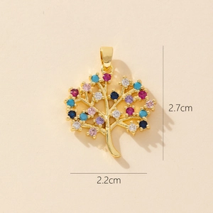 Macro shot of gold tree of life pendant with colorful gems and size 2.7cm by 2.2cm