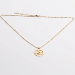 Polished gold stainless steel Mama pendant necklace with butterfly detail on white background
