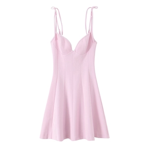 Detail view of adjustable pink floral poplin dress straps with knot tie design