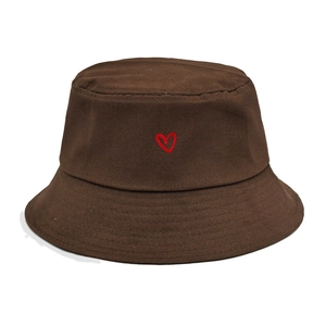 Detail of red heart embroidery on dark brown cotton bucket hat with durable stitching