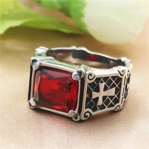 Gothic punk silver ring with a large rectangular red stone and cross engravings