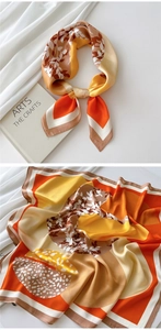 Detail of silk-like square scarf featuring orange and yellow geometric leaf patterns