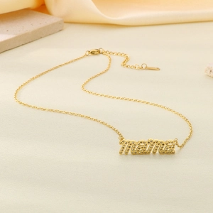 Detailed close-up of 18K gold plated mama letter pendant with sparkling crystal accents