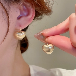 Minimalist matte gold heart hoop earrings for women with elegant metallic texture