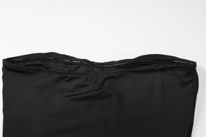 Detail of internal silicone non-slip strip on black strapless dress for secure fit