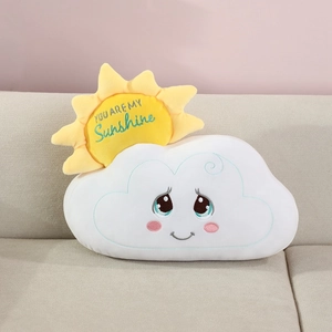 Close-up of sunshine embroidery and cute face on cartoon cloud plush pillow