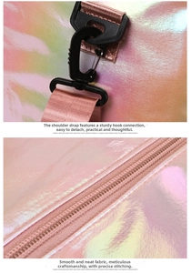Detail of pink gradient duffel bag showing durable swivel hook and high-quality zipper stitching