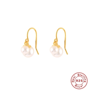 Detailed shot of double pearl drops with S925 sterling silver hooks in gold finish
