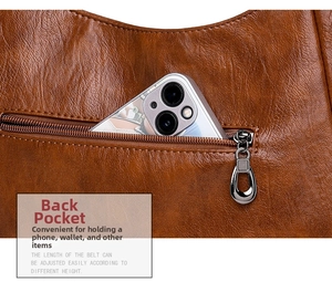 Detailed view of the back zipper pocket on brown leather bag with smartphone size reference