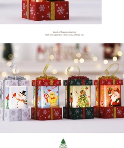 Detailed view of four Christmas gift box LED lamps with snowman and Santa motifs