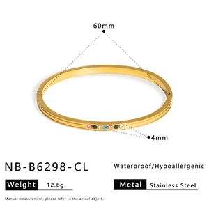 Detail view of 60mm gold stainless steel bangle with colorful inset stones and specs