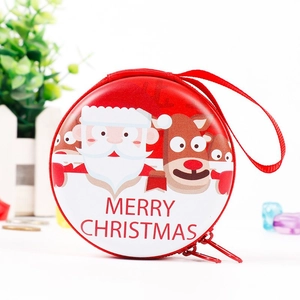 Detailed view of round Christmas tin coin purse with Santa and reindeer pattern