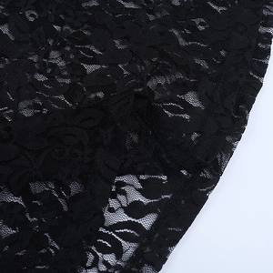 Close-up of intricate floral black lace mesh fabric showing detailed embroidery textures