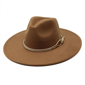Close-up of wide brim wool fedora hat with beige leather strap and gold buckle