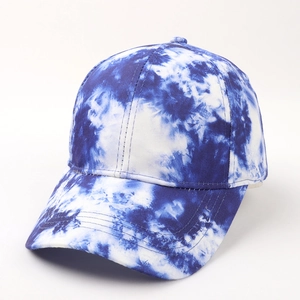 Detail shot of the blue and white tie-dye pattern on a structured cotton baseball cap