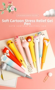 Close-up of cute cartoon squishy pens in animal shapes like cats and rabbits on a notebook