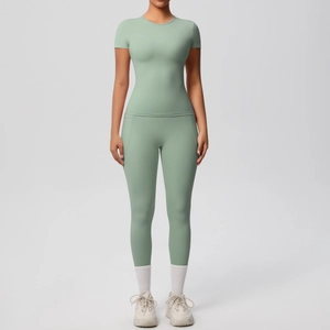 Detail of mint green yoga set showing high-elasticity fabric texture and wide waistband