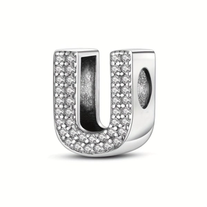 Detailed close-up of a silver-plated alphabet U charm bead with pavé zircon stones
