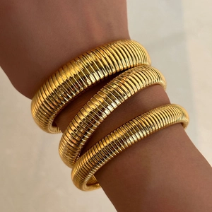 Polished 18k gold plated vintage style flexible Tubogas bracelet for women worn on wrist