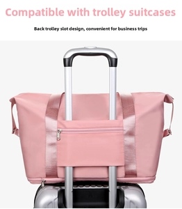 Pink foldable sports fitness travel bag featuring a back trolley sleeve for luggage
