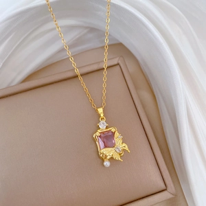 Elegant gold titanium necklace featuring pink zircon stone with butterfly and pearl detail