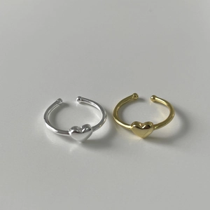 Minimalist silver and gold heart rings with open design and polished spherical ends