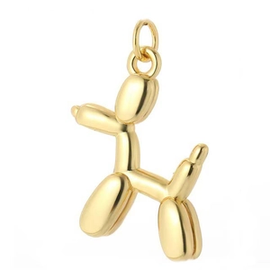 Detail view of a polished golden balloon dog pendant with a smooth metallic finish