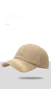 Detail shot of khaki cotton baseball cap with 3D embroidery and vintage distressed finish