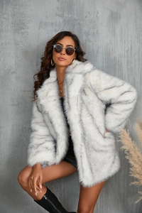 Detail of white faux fur coat with grey stripes featuring a plush wide collar