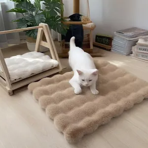 Plush pet bed mat with wave-pattern quilting for cats and dogs in warm coffee and white