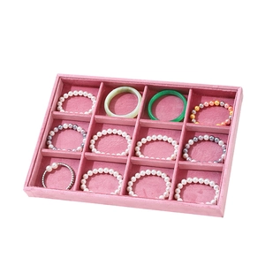 Pink velvet jewelry display tray with 12 compartments for rings and bracelets