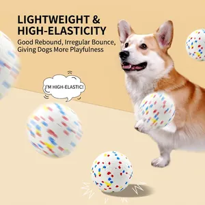 High-elasticity E-TPU pet training ball with colorful spots for dogs, bouncing with Corgi