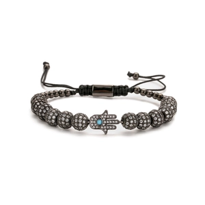 Adjustable black bead bracelet with Hamsa Hand and turquoise stone center on white background