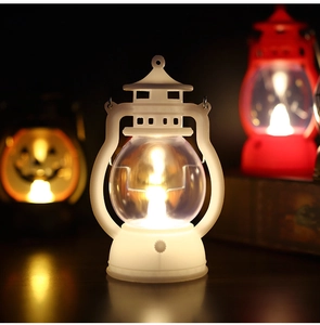 Detail of white vintage LED lantern with warm light and hanging ring for Halloween decor