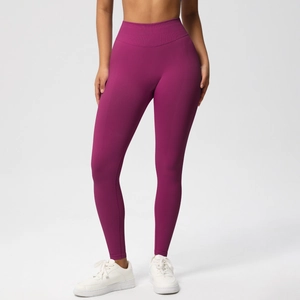 Macro detail of high-waist seamless yoga leggings in magenta with wide waistband