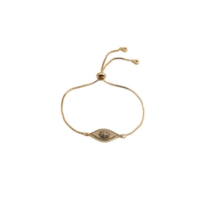 Adjustable gold evil eye bracelet with colorful cubic zirconia stones on white background