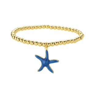 Golden beaded bracelet featuring a vibrant blue starfish pendant on a clean white background