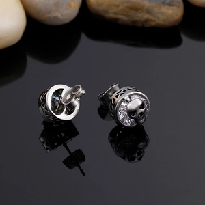 Gothic skull stud earrings in stainless steel with sparkling clear zircon accents for men