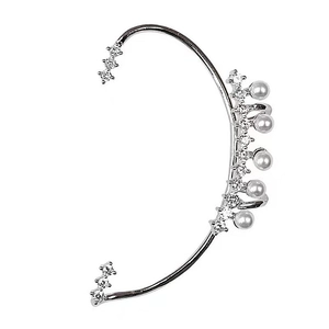 Detail of silver ear cuff clip featuring white pearls and sparkling clear diamonds