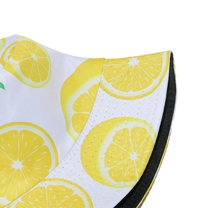 Close-up of vibrant yellow lemon pattern and high-quality twill fabric on sun hat