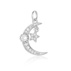 Macro detail of silver crescent moon and star pendant with clear zircon gemstones