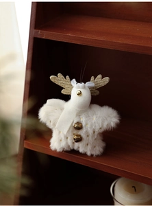 Detailed plush white Christmas reindeer ornament with gold sequins and metal bells