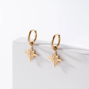 Elegant gold octagonal star drop earrings with cubic zirconia on a minimalist base
