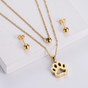 Three-piece jewelry set with gold hollow paw pendant necklace and ball stud earrings