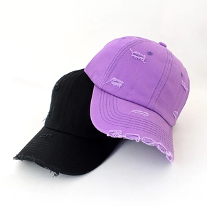 Vintage distressed baseball caps in purple and black with torn details and a soft brim
