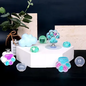 DIY silicone molds for drawer handles featuring cat paw cloud and crystal shapes on display